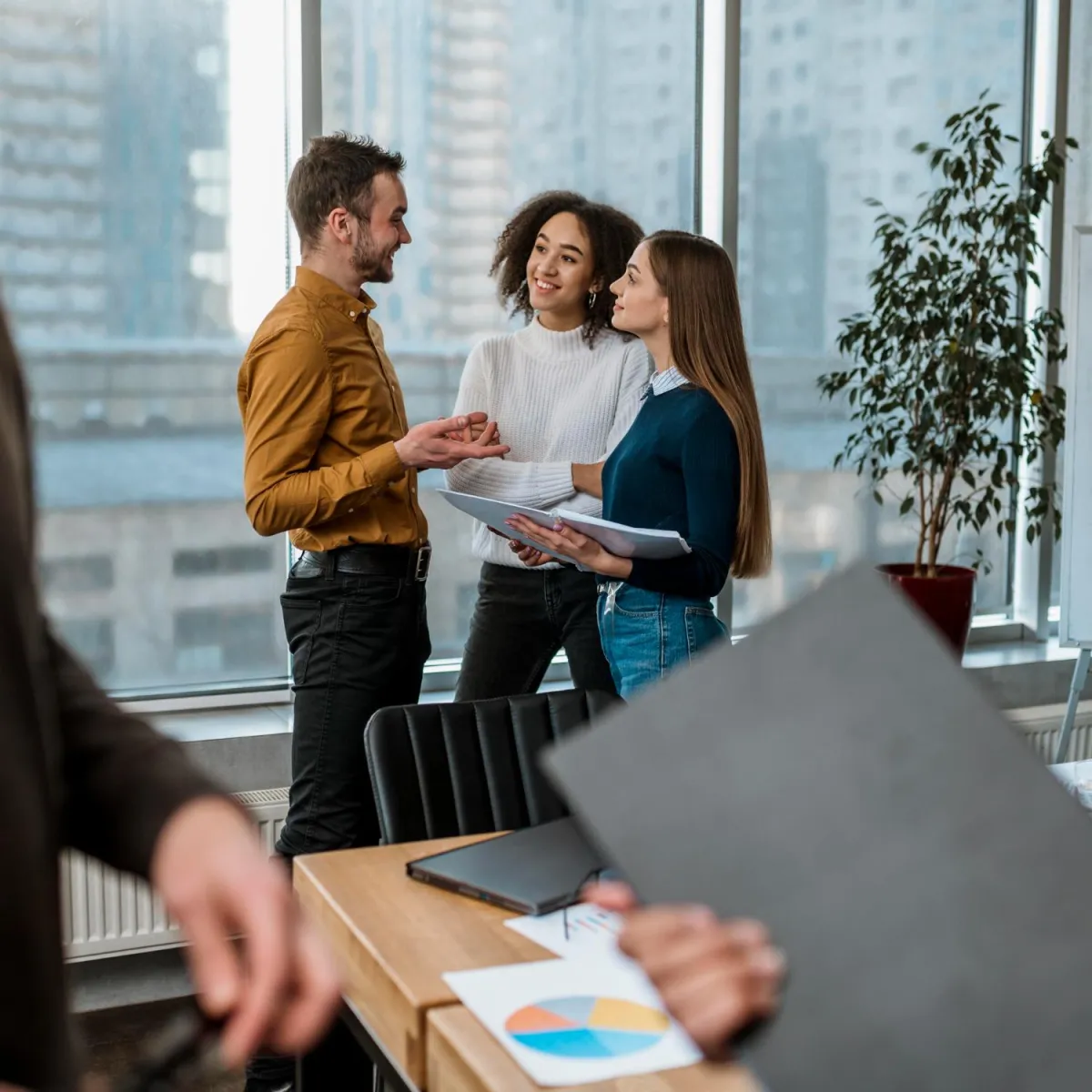 Colleagues discussing a project in a Toronto office